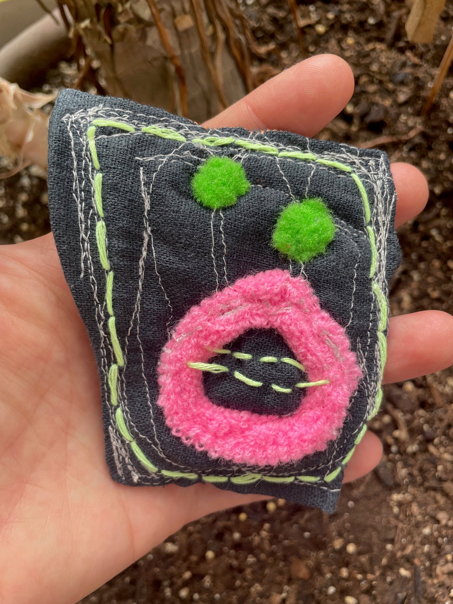 shocked creature w/ tree-frog-colored eyes / a brooch / one-of-a-kind
