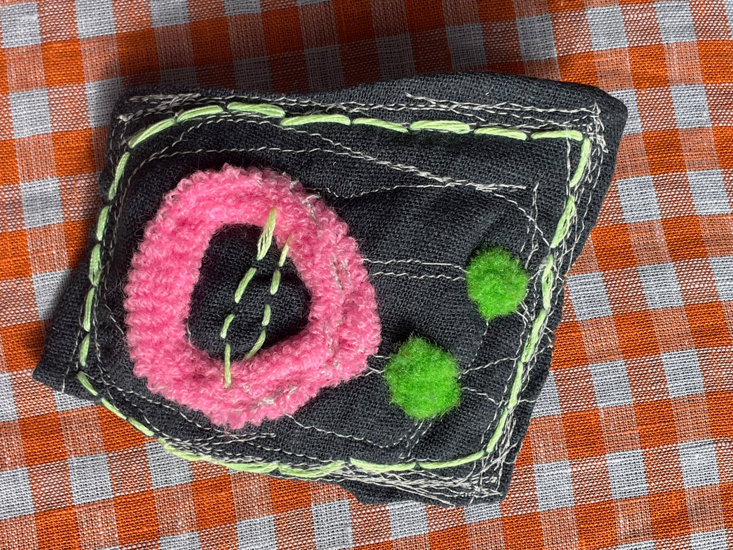 shocked creature w/ tree-frog-colored eyes / a brooch / one-of-a-kind